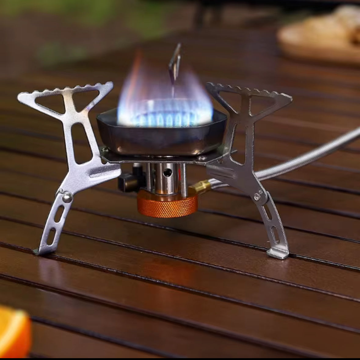 Portable backpacking stove with piezo ignition