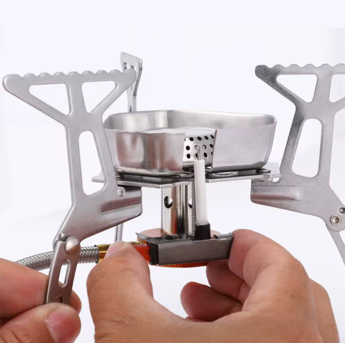 Portable backpacking stove with piezo ignition
