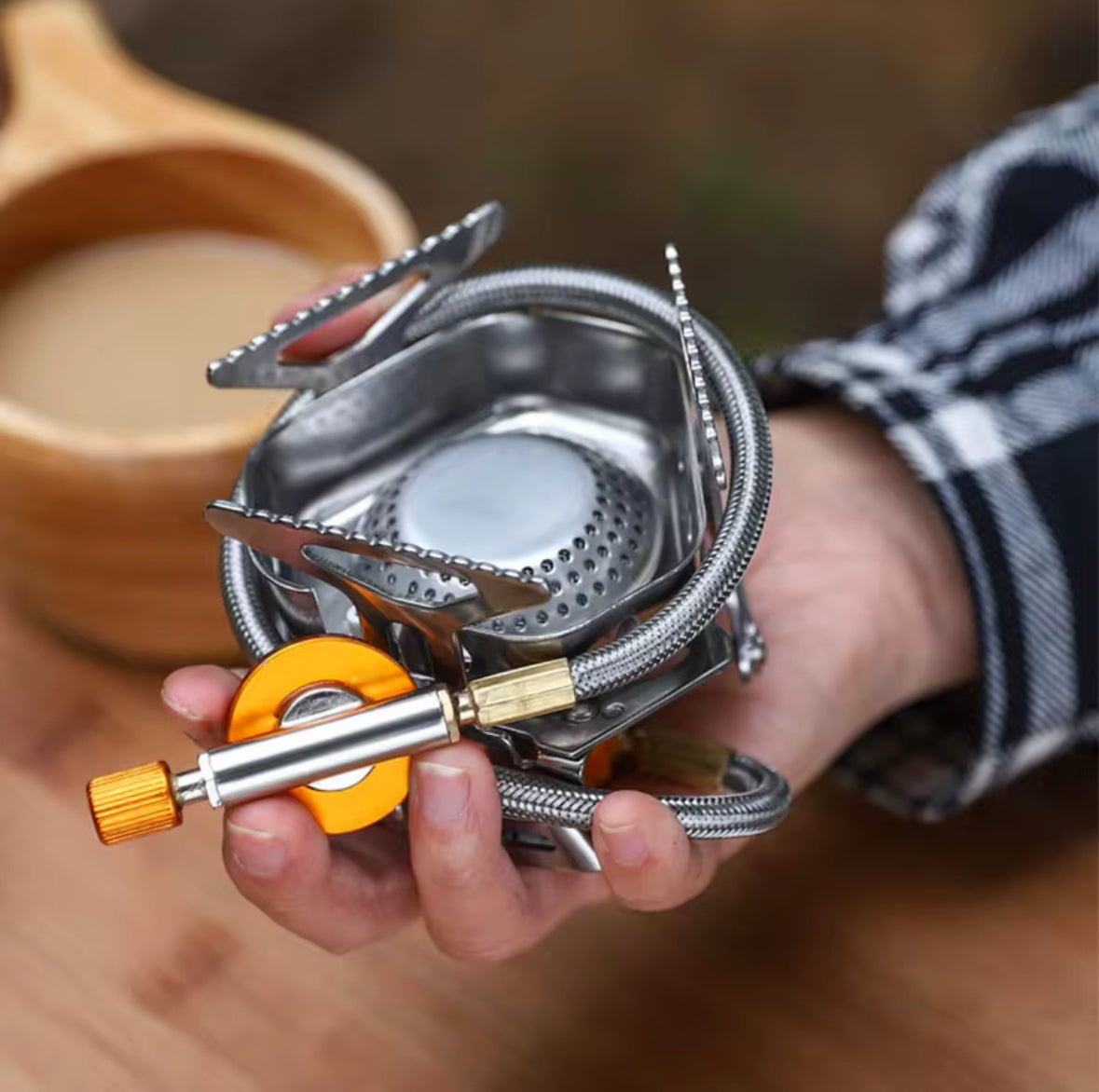 Portable backpacking stove with piezo ignition